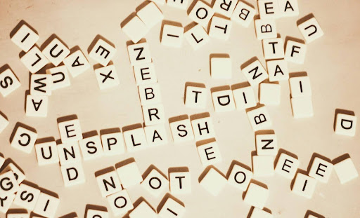 Scrabble tiles showing English words